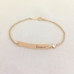 Baby Girl Bar Bracelet, Gold Bar with Crystal Bracelet, Baby Jewelry, Christening Gift, Bridesmaid Bracelet, Name Bracelet, Personalized BarAvailable in Sterling Silver, 14K Gold Filled, 14K Rose Gold FilledPlease drop a message of name in the note box at checkout.Specification. All component is Sterling Silver / 14K Gold Filled/ 14K Rose Gold Filled. Bar size 5 x 30mm. Crystal CZ size 4mm. Thicker Rolo Chain. Comes in a satin pouch. Length includes bar, jump ring and claspIMPORTANT:Usually jewe Dainty Engraved Gold Adjustable Bracelet, Adjustable Gold Nameplate Bracelet For Birthday, Adjustable Nameplate Gold Bracelet For Birthday, Personalized Wedding Chain Bracelet, Adjustable Personalized Gold Bracelet For Wedding, Dainty Adjustable Name Bracelet For Bridesmaid Gift, Personalized Adjustable Gold Bracelet For Wedding, Adjustable Engraved Name Bracelet For Bridesmaid Gift, Dainty Adjustable Nameplate Bracelet