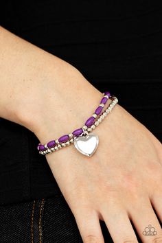 A shiny silver heart dangles from a strand of playful purple beads. It is paired with a strand of round silver beads threaded along a stretchy band for a whimsical charm around the wrist.

 Sold as one pair of bracelets. Candy Grams, Purple Candy, Rose Gold Beads, Purple Beads, Purple Bracelet, Purple Pearl, Paparazzi Accessories, Stretchy Bracelets, Paparazzi Jewelry