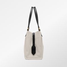 This medium canvas tote bag is a must-have for anyone who appreciates high-quality, stylish accessories. Made in Italy by the renowned designer Tom Ford, it boasts a printed logo and multiple ways to carry - by hand, elbow, or shoulder. Perfect for any occasion, this versatile bag is sure to impress. Designer Canvas Shoulder Bag, Designer Medium Bags For Daily Use, Designer Tote Shoulder Bag For On-the-go, Designer Canvas Bag For Daily Use, Designer Travel Canvas Bag With Dust Bag, Designer Canvas Tote Bag With Top Carry Handle, Designer Canvas Tote Bag With Top Handle, Designer Tote Shoulder Bag For Everyday Use, Designer Canvas Shoulder Bag With Handles