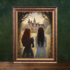 two girls looking at a painting in a frame