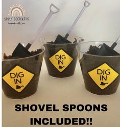 three plastic cups with dirt in them and dig in stickers on the lids for shovels