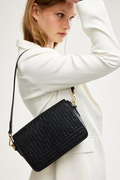 The Elsa Woven Crossbody Bag - a timeless piece made for your everyday. Inspired by the classic French-girl style this modern take on the baguette shape is designed to withstand seasonal trends and effortlessly elevate any outfit. Wear it three ways: as a crossbody, as a shoulder bag, or remove the strap and carry it as a sophisticated clutch. Handy external back pocket for your phone. (Includes leather shoulder strap and leather crossbody strap). Crafted from luxurious, buttery soft premium lea Classic Baguette Bag With Adjustable Strap For On-the-go, Versatile Rectangular Saddle Bag With Adjustable Strap, Classic Crossbody Baguette Bag For On-the-go, Chic Rectangular Saddle Bag For Travel, Classic Crossbody Baguette Bag On-the-go, Classic On-the-go Crossbody Baguette Bag, Modern Crossbody Baguette Bag With Removable Pouch, Modern Everyday Crossbody Baguette Bag, Classic Rectangular Baguette Bag For On-the-go