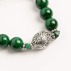 "Find the John Bead Malachite Natural Stone Stretch Bracelet with Flower Beads at Michaels. com. This handmade bead bracelet, made using dyed green malachite and silver flower beads, will make a fantastic addition to your accessory collection. This charming stretch bracelet uses high-quality elastic, which is sturdy and able to be stretched to fit most wrists. This handmade bead bracelet, made using dyed green malachite and silver flower beads, will make a fantastic addition to your accessory co Green Malachite Beaded Bracelets, Handmade Green Malachite Bracelets, Green Malachite Beaded Bracelets As Gift, Green Malachite Beaded Bracelet As Gift, Malachite Beaded Bracelets As Gift, Malachite Beaded Bracelet As A Gift, Green Polished Bead Bracelet, Green Polished Beads Bracelet, Handmade Malachite Bracelets With Round Beads