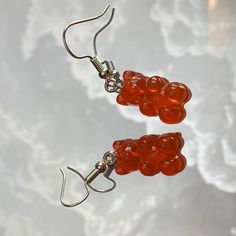 Try on our Cherry Flavored (NON-EDIBLE) Gummy Bear Dangle Earrings! It's a red gummy bear sized earring (17mm) made from Resin, hooked onto a hypo-allergenic silver earring hook. The total size of the earring drops to 1 1/2 inches from your earlobe! This earring is a part of our DULCE COLLECTION! Check out our other Gummy Bear Earring flavors: Licorice, Vanilla, Pink Lemonade, Grape, Hawaiian Punch, Lime, Tangerine, and Pineapple. (DO NOT EAT THEM THOUGH! They're just delicious Eye Candy!) Hawaiian Punch, Earring Hook, Cherry Flavor, Gummy Bear, Pink Lemonade, Gummy Bears, Etsy Earrings Dangle, Silver Earring, Licorice