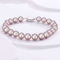 Embrace an aura of mystique and elegance with our Purple Freshwater Pearl Bracelet. These unique purple pearls, carefully assembled in a harmonious strand, exude a regal charm that's hard to resist. Perfect for adding a touch of sophistication to any attire, this bracelet is an embodiment of both modern style and timeless grace. Let the alluring shade of purple, symbolizing wisdom and creativity, become your signature statement piece. Product Information Pearl Type Freshwater Origin China Shape Baroque Pearls Necklace, Mother Of Pearl Earrings, Baroque Pearl Earrings, Purple Pearl, Freshwater Pearl Bracelet, Gold Pearl Necklace, Gold Pearl Earrings, Freshwater Pearls Earrings, Square Pendant