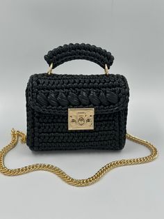 ELEGANT HIGH QUALITY BAGS 🛍️🛍️🛍️       Product Description:  ✨It is handcrafted with love using high-quality metallic yarn, giving it a unique and luxurious look. The black metallic color adds a touch of elegance and sophistication, making it perfect for both day and night occasions. ✨ The lining is carefully chosen to match the bag's color, adding a seamless finish to the overall design. ✨ It sits comfortably on your shoulder and adds a touch of glamour to any outfit. Whether you're heading Black Handmade Rectangular Shoulder Bag, Elegant Handmade Black Bag, Black Handmade Rectangular Bag, Handmade Black Bag As A Gift, Handmade Black Bag As Gift, Handmade Black Bag For Gift, Handmade Black Party Bag, Luxury Handmade Crochet Bag As Gift, Luxury Handmade Crochet Bag For Gift