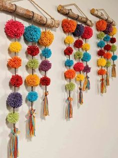 multicolored pom - poms hanging on the wall