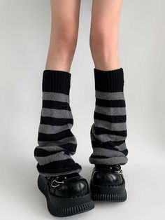 Step back into the iconic Y2K era with these stylish Striped Knit Flare Leg Warmers. Crafted with a cozy knit material, these leg warmers feature a retro striped pattern. The flared design at the bottom provides a unique silhouette. Y2k Style Black Leg Warmers For Winter, Black Leg Warmers For Fall Streetwear, Casual Leg Warmers For Fall, Casual Striped Leg Warmers For Fall, Casual Striped Leg Warmers For Winter, Fitted Leg Warmers For Winter Streetwear, Ribbed Leg Warmers For Winter, Winter Fitted Leg Warmers For Streetwear, Trendy Fitted Leg Warmers For Streetwear