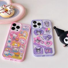 two cell phones with hello kitty stickers on them