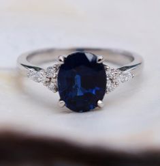 an oval shaped blue sapphire and diamond ring