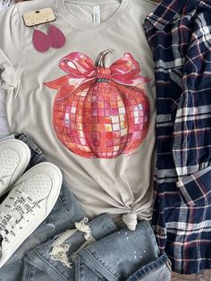 This super fun disco vibe pumpkin is perfect for fall in these vibrant colors printed DTG on Bella Canvas blended tee. Disco Pumpkin, Tyler Candle Company, Rhinestone Tees, Easter Tees, Thanksgiving Tee, Patriotic Tees, Kids Graphic Tees, Vintage Havana, Mom Tees