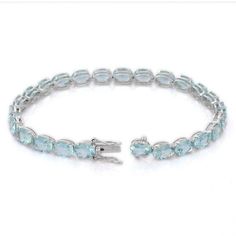 This is part of Chairish’s Fine Jewelry assortment.  This Aquamarine Tennis Bracelet in 18K gold showcases 25 endlessly sparkling natural aquamarine, weighing 15.83 carats. It measures 7.25 inches long in length.  Aquamarine is useful for moving through transition and change.  Designed with perfect oval cut aquamarine set in solid gold making a tennis bracelet to make you stand out on any occasion or event. The elegant style complements the attire beautifully and this is a perfect Unique Gift, B Luxury Oval Aquamarine Jewelry, Elegant Aquamarine Silver Bracelets, Luxury Blue Topaz Bracelets, Elegant Aquamarine Bracelet Jewelry, Luxury Blue Topaz Bracelets For Formal Occasions, Elegant Light Blue Aquamarine Bracelet, Luxury Blue Topaz Gemstone Bracelets, Elegant White Gold Bracelet With Blue Topaz, Formal Blue Topaz Gemstone Bracelets