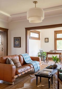 a living room with two couches and a coffee table in it's center