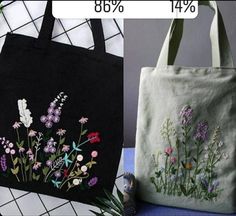 two bags with embroidered flowers on them, one is black and the other is white