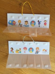 two plastic dividers with children's pictures on them