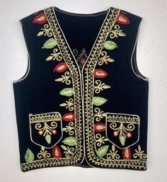 Festive Vest With Multicolor Embroidery, Traditional Red Vest For Festival, Festive Embroidered Vest For Festivals, Traditional Sleeveless Winter Vest, Traditional Festive Winter Vest, Festive Embroidered Vest With Multicolor Embroidery, Festive Embroidered Multicolored Vest, Traditional Winter Festive Vest, Traditional Multicolor Embroidered Vest For Festivals