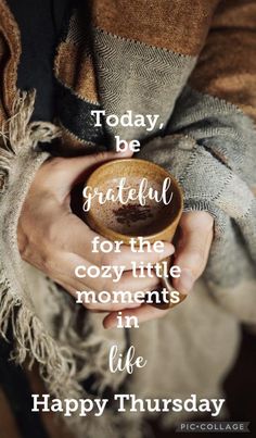 a person holding a cup with the words today be grateful for the cozy little moments in life