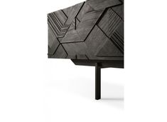 the side view of a black cabinet with geometric designs on it's doors and sides