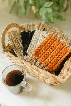 crochet coasters in a basket next to a cup of coffee