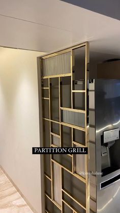 a metallic refrigerator freezer sitting inside of a kitchen next to a wall mounted oven