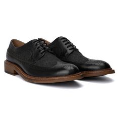 The irresistible Garret shoe by Vintage Foundry Co. exceeds expectations for a classic pair of oxfords. With its delicate design and dual-tone construction, this lace-up style stands out and demands a second look. Perfectly blending timeless elegance with a modern twist, the Garret shoe elevates any outfit, whether formal or smart-casual. Its distinctive look and superior craftsmanship ensure you make a memorable impression, combining sophistication with a bold, eye-catching design. Lace-up Oxford Shoes With Rubber Sole, Black Moc Toe Oxfords For Semi-formal Occasions, Wingtip Oxford Lace-up Shoes With Textured Sole, Black Wingtip Lace-up Shoes With Textured Sole, Semi-formal Oxford Shoes With Rubber Sole, Leather Oxford Shoes With Rubber Sole For Semi-formal Occasions, Textured Sole Wingtip Oxfords, Black Business Oxfords With Textured Sole, Wingtip Dress Shoes With Rubber Heel Cap For Derby