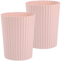 two pink cups sitting next to each other