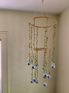 a wind chime hanging from the ceiling in a room