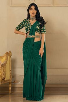 Emerald green georgette pre-stitched saree with pleats. Comes with a tussar silk padded blouse with floral motifs, sequins and zari hand embroidery and a belt - Aza Fashions Pista Green Georgette Pre-draped Saree With Dupatta, Bollywood Style Green Sharara For Formal Occasions, Green Bollywood Style Sharara For Formal Occasions, Formal Fitted Pre-draped Saree With Cutdana, Formal Bollywood Green Sharara, Formal Georgette Choli With Traditional Drape, Elegant Green Choli With Sheer Dupatta, Elegant Pre-draped Pista Green Saree With Sheer Dupatta, Formal Green Semi-stitched Sharara