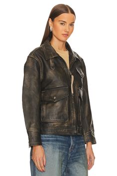 Self: 100% genuine leather, Lining: 100% polyester.  Made in Pakistan.  Professional leather clean only.  Front zipper closure.  Breast pocket and side button pockets.  D-ring and strap detail at front with button cuffs.  Leather fabric with adjustable strap at back.  .  .  .  .  .  .  .  .  . Chic Leather Biker Jacket With Button Closure, Fall Leather Biker Jacket With Multiple Pockets, Leather Biker Jacket With Multiple Pockets For Fall, Utility Leather Jacket With Pockets, Leather Pocket, Pocket Jacket, Leather Biker Jacket, Leather Cleaning, Leather Fabric