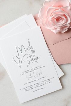 wedding stationery with pink roses and envelopes