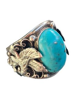 This beautiful, signed Native American Navajo ring is a stunning piece of vintage jewelry that features an oval-shaped Kingman turquoise and pyrite stone set in 925 sterling silver. The ring size is between 9.25 and 9.50 and has an eagle in flight on each side. The ring is handmade and is perfect for both men and women who appreciate the beauty of Native American jewelry. The color of the stone is a beautiful shade of Robin's egg blue that is complemented by the silver setting. This ring is a so Bohemian Oval Turquoise Ring With Patina, Antique Oval Turquoise Ring In Silver, Bohemian Oval Turquoise Collectible Ring, Pyrite Stone, Eagle In Flight, Navajo Ring, Eagle Ring, Robin's Egg Blue, Navajo Rings