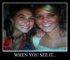 two young women are smiling and posing for the camera