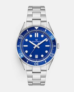 Case diameter: 40 mmCase thickness: 11.8 mmMaterial: Rhodium-plated 316L stainless steelDial: Blue dial in brass Bezel: Rotating ceramic bezelIndex & hands: Applied indices, luminous handsGlass: Flat Sapphire Crystal GlassMovement: Ronda 715Second hand: Yes, tickingWater Resistance: 10 ATM (snorkeling)Strap: Solid stainless steel with white gold PVD platingSize: All our straps are adjustable and fit wrists of all sizes Bracelet size: Available in size S, M & L. See our size chart to find your si Modern Blue Watch With Metal Dial, Modern Blue Watch Accessories With Metal Dial, Modern Blue Automatic Watch Accessories, Classic Blue Watches With Stainless Steel Clasp, Modern Blue Watch With Polished Finish, Blue Round Watch With Subdials, Blue Automatic Round Watches, Luxury Blue Stainless Steel Watches, Blue Luxury Stainless Steel Watches