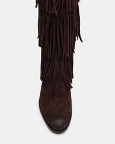 Upgrade your wardrobe with the SPUR fringe boot. These boots feature a fringe detailing that adds a touch of effortless style. Perfect for any occasion, these boots will elevate your look while providing comfort and durability. 1 inch heel height 14.5 inch shaft circumference 15 inch shaft height Suede upper material Synthetic lining Leather sock Synthetic sole Fit tip: If you are in between sizes, size up a half-size Imported Leather Fringe Boots For Fall, Western Fringe Boots For Fall, Winter Fringe Ankle Boots, Western Suede Fringe Boots, Western Style Suede Boots With Fringe, Brown Fringe Winter Boots, Suede Fringe Boots, Fringe Boots, Leather Socks