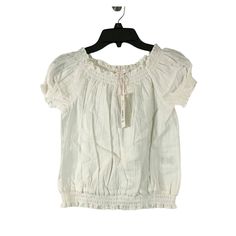 Brand: Gb Girls New With Tags Size: L Color: White Material: 100% Cotton Features: - Short Sleeves - Smocked Trim - Woven Fabric - Cropped Retail Price: $34.00 Casual Short Sleeve Puff Top, Cute Ruffled Puff Sleeve Tops, White Cotton Peasant Top With Ruffles, White Ruffled Cotton Peasant Top, Spring Cotton Ruffle Short Sleeve Top, Casual Cotton Peasant Top With Puff Sleeves, Casual Cotton Puff Sleeve Peasant Top, Casual Short Sleeve Peasant Top With Ruffles, Casual Cotton Peasant Top With Ruffles