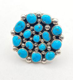 Darlene Begay Kingman Turquoise and Sterling Silver Cluster Ring, Adjustable Size 11 15 turquoise stones adorn the face of this impressive ring.  1-1/2" across the face of the ring, and an adjustable shank makes this ring perfect for anyone wanting a showstopper on their finger. Signed "Darlene Begay" and stamped Sterling Navajo Collectible Blue Multi-stone Turquoise Ring, Collectible Multi-stone Blue Turquoise Ring, Flagstaff Az, Flagstaff, Turquoise Stones, Kingman Turquoise, Cluster Ring, Turquoise Stone, Rings Statement