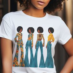 This ADULT UNISEX short sleeve shirt features four black women sporting afros and bellbottoms, evoking a nostalgic 70s vibe. Crafted from soft 100% cotton, this tee is comfortable and ready to wear for any occasion. Available in a variety of sizes and colors, it also boasts side seams for added durability. Refer to the included measurement chart to ensure the perfect fit. An excellent gift for those who appreciate retro style and cultural heritage. Shop The Trini Gee for more: https://www.etsy.com/shop/thetrinigee Fitted Retro Print Crew Neck Tops, Trendy Short Sleeve Top With Retro Print, Fitted Short Sleeve Shirt With Retro Print, Casual Fitted Tops With Retro Print, Casual Fitted Retro Print Tops, Groovy Relaxed Fit Short Sleeve Tops, Fitted Cotton Groovy Tops, Groovy Short Sleeve Top With Graphic Print, Groovy Graphic Print Top With Short Sleeves