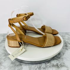 Elevate Your Style With These Gorgeous Joie Leather Sandals In A Beautiful Brown Tan Color. The Strappy Design And Open Toe Model Make Them Perfect For Any Occasion, Whether It's A Casual Day Out Or A Formal Event. The Ankle Strap And Buckle Closure Ensure A Secure Fit, While The Mid-Height Block Heel Provides Comfort And Support. These Sandals Feature Accents Of Raffia Jute And A Textile Upper Material, With A Faux Leather Lining Material And Synthetic Insole Material. They Are Perfect For The Casual Brown Low Heel Sandals, Beige Low Heel Sandals For Beach, Adjustable Block Heel Sandals For Vacation, Adjustable Sandals With Block Heel For Vacation, Leather Ankle Strap Heels For Vacation, Adjustable Heels With Buckle Closure For Vacation, Casual Beige Low Heel Sandals, Brown Low Heel Sandals For Summer, Natural Heels With Woven Sole And Ankle Strap