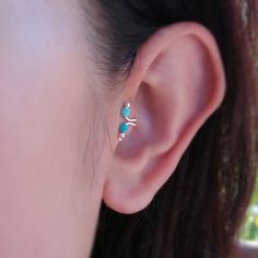 This is Tragus ear cuff set made by hand craft,Blending solid wire and setting with Blue Turquoise Then polished. Every product  is all hand made jewelry.Some of our design may have one of a kind. But reasonable price. Stone : Round Turquoise  3 mm Material: Solid Sterling silver 92.5 wire You can slide onto your ear and squeeze gently to your size,Simple clip earring around to your ear lobe with cute&Simple ear clip This  Tragus ear clip can be wear together with this Items ◇MORE FROM US◇ Neckl Turquoise Single Cartilage Earring As Gift, Fake Ear Cuff, Tragus Ear Cuff, Ear Cuff Silver, Tragus Jewelry, Piercing Tragus, Tragus Earring, Jewelry Ear, Front Back Earrings