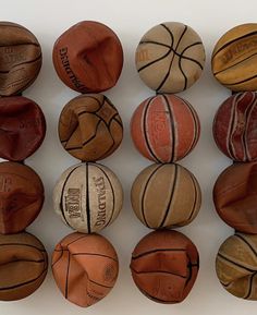 basketballs lined up in rows on a white surface