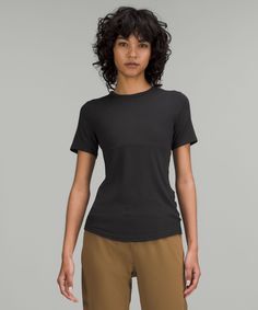 This lightweight everyday top has just the right softness, just the right stretch, and a snug fit that feels like a second skin. Designed for On the Move. Contours your body:Sits below the waistband for moderate, everyday coverage. 'Wash with like colours', 'Machine wash cold', 'Do not bleach', 'Tumble dry low', 'Do not iron', 'Do not dry clean', 'Imported'. Soft, Ribbed Modal Fabric. Body: 94% Lenzing modal, 6% Elastane. Technical Clothing, Modal Fabric, Short Sleeve Shirt Women, Short Sleeve Shirts, Shorts With Tights, Leggings Shop, Second Skin, Shirt Online, Snug Fit