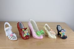 Pick the one you want: Ceramic Womens Shoes Sandal Slipper High Heeled Shoe Figurine This listing is for ONE shoe. Pick the one you want when you check out: White Sandal Red Shoe Pink Shoe Yellow Shoes Black Polka Dot Approx size of largest: 5 inches X 4 inches X 1 3/4 inches Approx size of smallest: 2.5 inches X 3.5 inches X 1 inch Made of breakable material. Most are made in Japan. I don't see any nicks in the ceramic in any of them. White Sandal, Mantle Piece, Yellow Shoes, Vintage Models, White Sandals, Cat Sitting, Pink Shoes, Black Polka Dot, Red Shoes