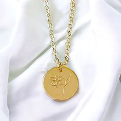 This Birth Month Flower Pendant Necklace is the ideal gift to celebrate a special birth month. With its elegant flower design, it is a thoughtful way to show your loved ones how much you care. Consider giving this unique piece of jewelry as a token of your affection. Material: 14K gold filled and plated Chain: 14K gold filled 16.5” Rolo chain Pendant: 14K gold plated hand stamped flower Lead and nickel free Delivered in a soft protective jewelry pouch and gift box Crafted in the USA Ships from M Spiritual Birth Flower Pendant Charm Necklace, Spiritual Birth Flower Pendant Jewelry, Spiritual Birth Flower Pendant Necklace, Hypoallergenic Gold Plated Necklace For Gift, Gold Spiritual Necklace With Birth Flower, Minimalist Flower Charm Jewelry Gift, Birth Flower Pendant Necklace As Gift For Mom, Minimalist Birth Flower Pendant Necklace, Elegant Birth Flower Charm Necklace As Gift