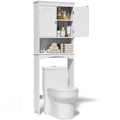 a white toilet sitting next to a tall cabinet with towels on it's sides