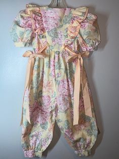 "Cute floral handmade romper /jumpsuit / No labels being handmade / True vintage measures pit to pit 13\"/ waist 12\"/ inseam 14 1/2\" / length (shoulder to bottom leg) 33\"/ smoke free environment - Amazing Seamstress a one of a kind for sure ! No issues - smoke free home (104)" Cute Bubble Romper Overall For Spring, Vintage Floral Print Jumpsuit For Spring, Pink Retro Jumpsuits And Rompers For Spring, Vintage Summer Overalls Jumpsuit, Fitted Vintage Floral Print Jumpsuits And Rompers, Vintage Overall Jumpsuits And Rompers For Spring, Spring Retro Overalls Jumpsuits And Rompers, Pink Floral Print Jumpsuits And Rompers For Garden Party, Vintage Cotton Jumpsuits And Rompers With Short Sleeves