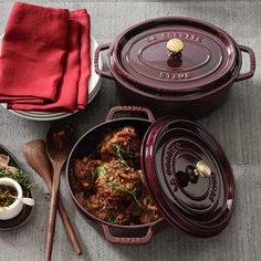 the casserole dish is full of meat and vegetables, along with other dishes