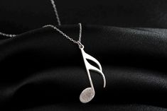 Actual Fingerprint Music Note Necklace, Musician Gift, Treble Clef Jewelry, Birthday Gift, Musical Charm, Note Jewelry, Music Lover Gift TO OUR VALUED CUSTOMERS ! Please take a look at our special catalog that we have prepared for you ! ▶ https://www.etsy.com/shop/MarryMinimalist ✔️ All products in our unique store are personalized. ( You can find our font list in the images ) D E T A I L S ✔️A lifetime silver CLEANING CLOTH is given as a GIFT along with the 925 Sterling Silver Necklace! ✔️ * Made to Order. * Handmade with Sterling %100 925K Sterling Solid Silver. * Choice of Gold Color: Gold, Rose Gold, Silver * Length: 14", 16", 18", 20", 22" * Ready to Ship in 1-3 Business Days * Free returns within 14 days from the order date. ✔️ 24/7 Friendly Customer Service, contact us for any quest Treble Clef Jewelry, Music Note Necklace, Silver Cleaning, Musician Gifts, Treble Clef, Jewelry Birthday, Music Note, Gift For Music Lover, Music Lover