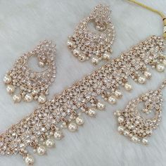 the necklace and earrings are all made up of pearls