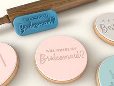 the cookies are decorated with different types of words and phrases on them, including will you be my bridesmaid? or will you be my bridesmaid?