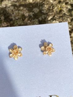 A pair of solid gold tiny daffodil earrings, beautiful little miniature studs cast from an original hand carved Victorian flower design. The earrings are perfect for that Spring feeling after a long winter, very floral, fitting the botanical trend at the moment. Tiny floral studs are all the rage. Perfect for every day wear, the studs have lovely hand crafted solid posts and backs and every single one is handmade in my Devon studio. These little English country garden daffodils are really sweet, Gold Flower Earrings With 3d Flowers, Yellow Gold Flower Earrings For Gift, Yellow Gold Flower Earrings As Gift, Yellow Gold Birth Flower Earrings Gift, Delicate Tiny Gold Flower Earrings, Yellow Gold Birth Flower Earrings, Tiny Flower-shaped Earrings For Gift, Tiny Flower Earrings As A Gift, Tiny Flower Earrings For Gifts